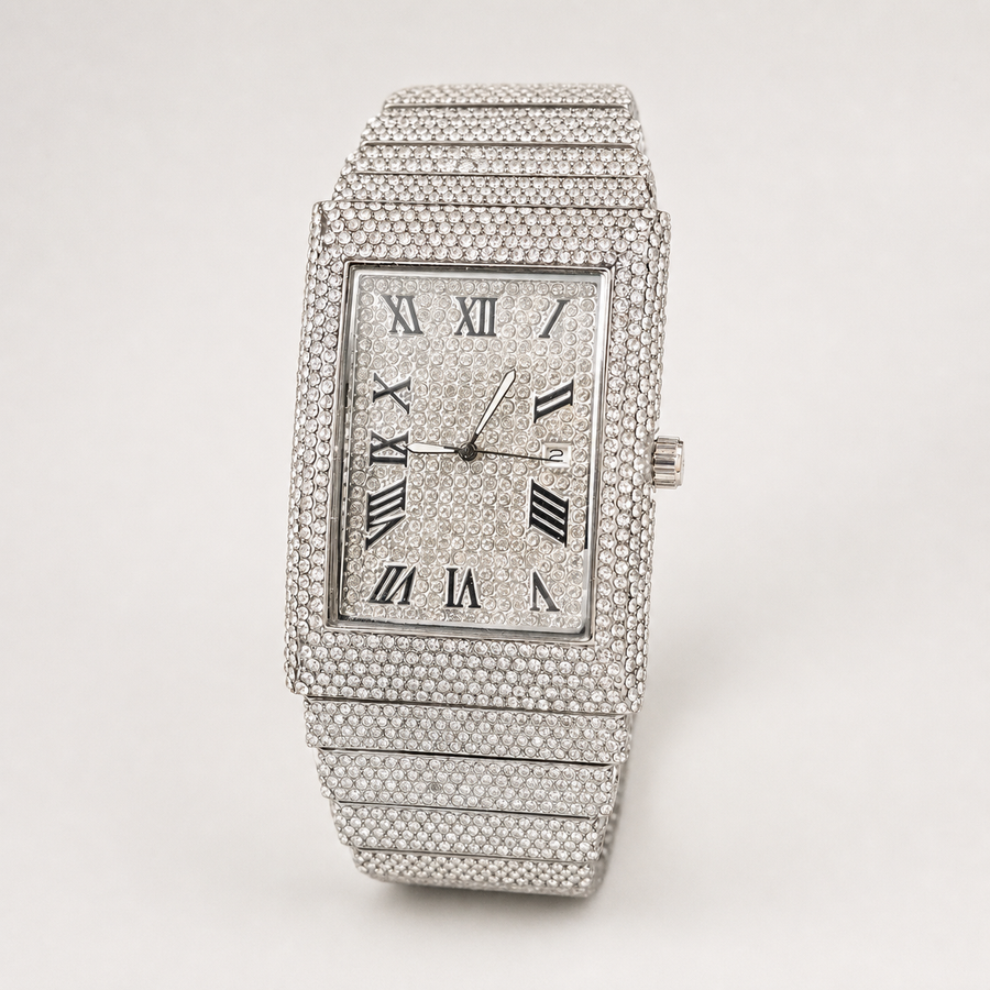 Angled view of silver-tone rectangular watch with Roman numeral dial and date window