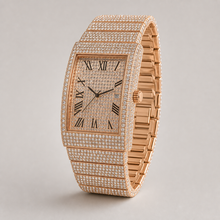 Angled view of rose-gold-tone rectangular watch showing crown and bracelet