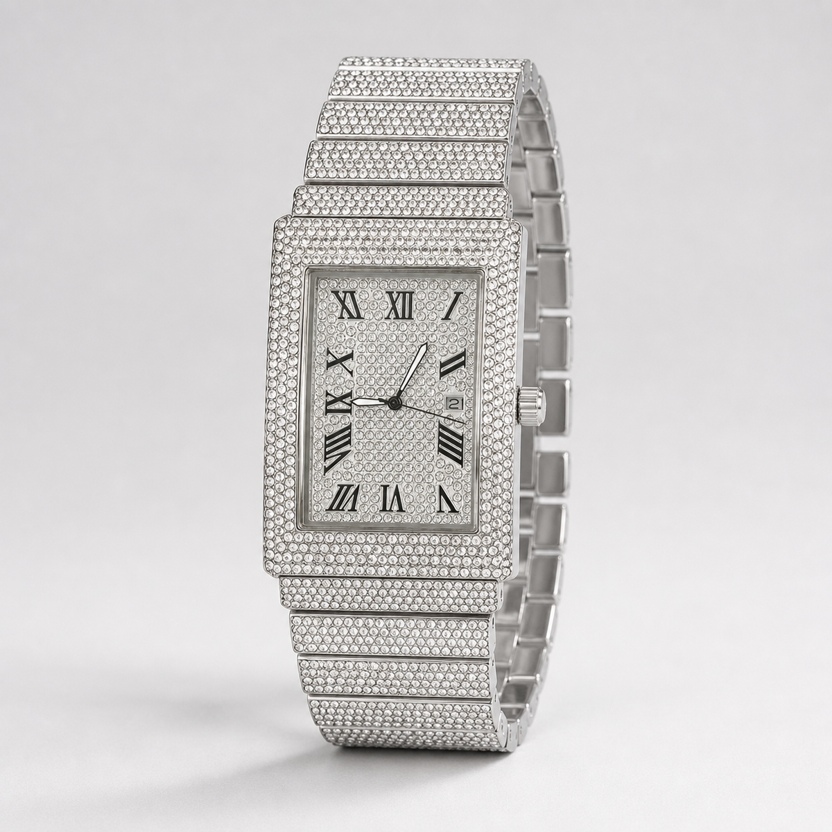 Side view of silver-tone rectangular watch with Roman numeral dial and date window