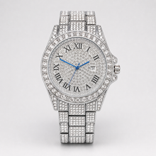 Silver-tone round quartz watch with blue hands and Roman numeral dial, straight-on front view
