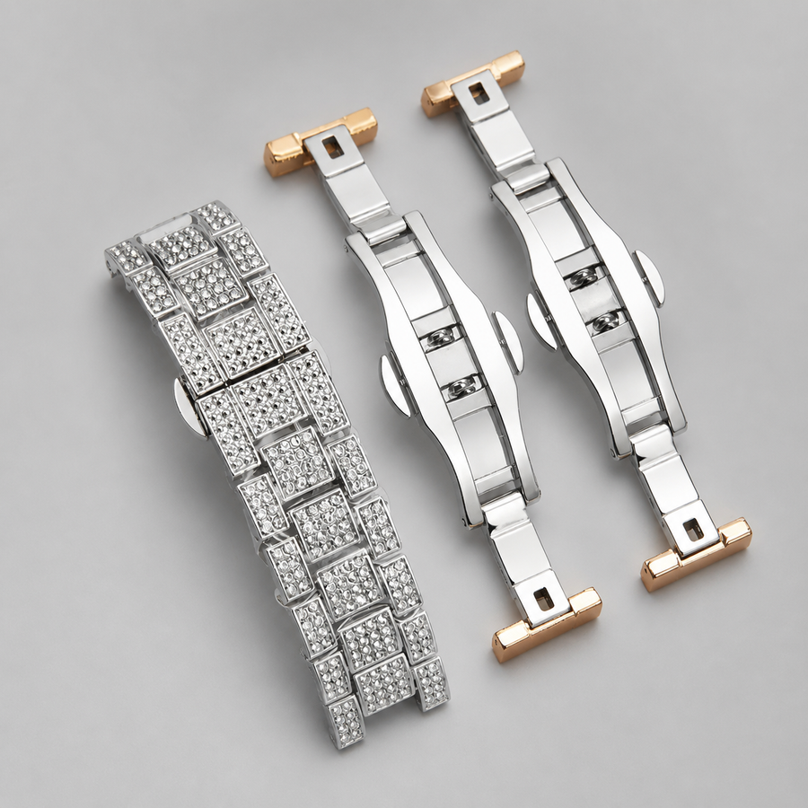 Silver-tone and rose-gold crystal-set bracelet and clasp components, close-up