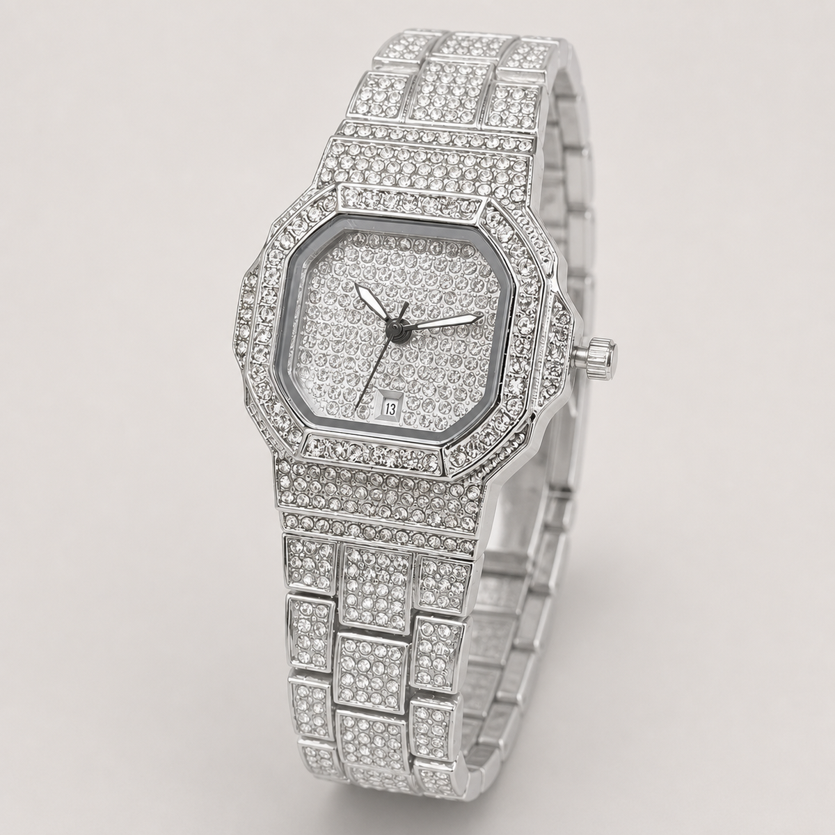 Silver-tone women’s octagonal quartz watch with a crystal-set grid bracelet, angled view