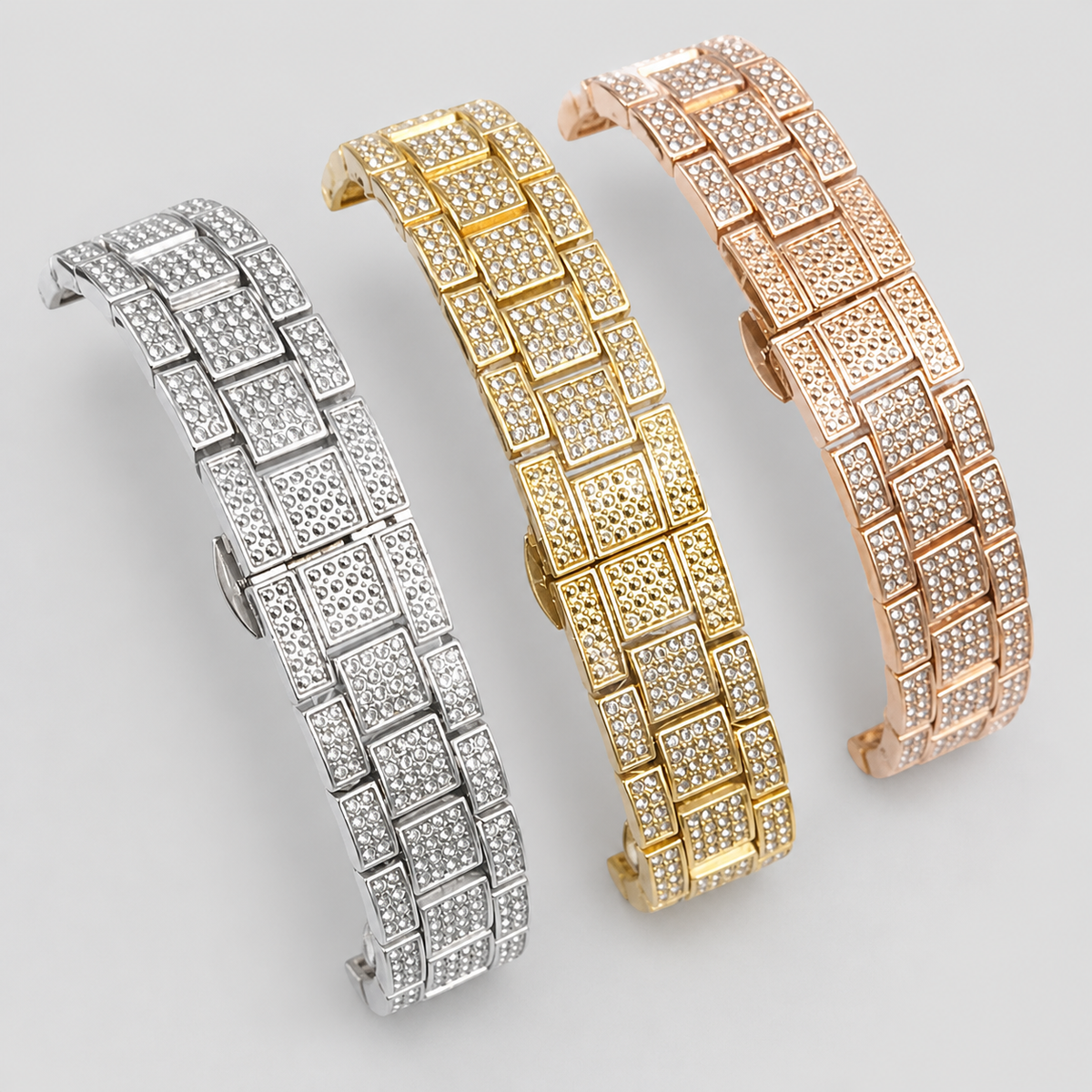 Silver-tone, gold-tone and rose-gold crystal-set watch bracelets, close-up