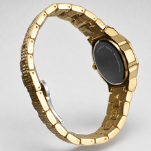 Rear view of a gold-tone octagonal watch with crystal-set bracelet