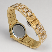 Rear and bracelet view of a gold-tone octagonal watch