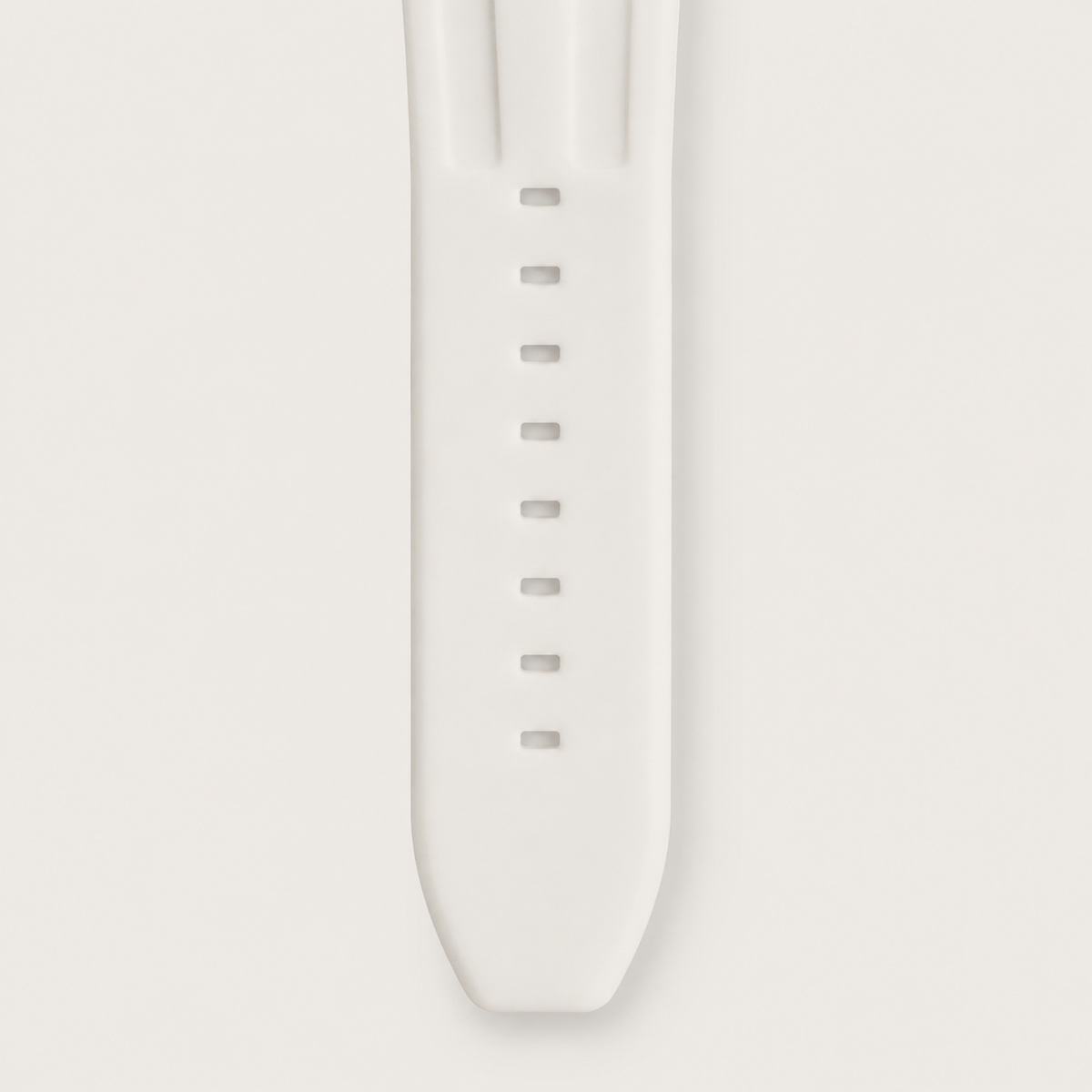White silicone watch strap with adjustment holes, close-up