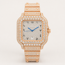 Rose-gold square watch with clear decorative border accents, front view