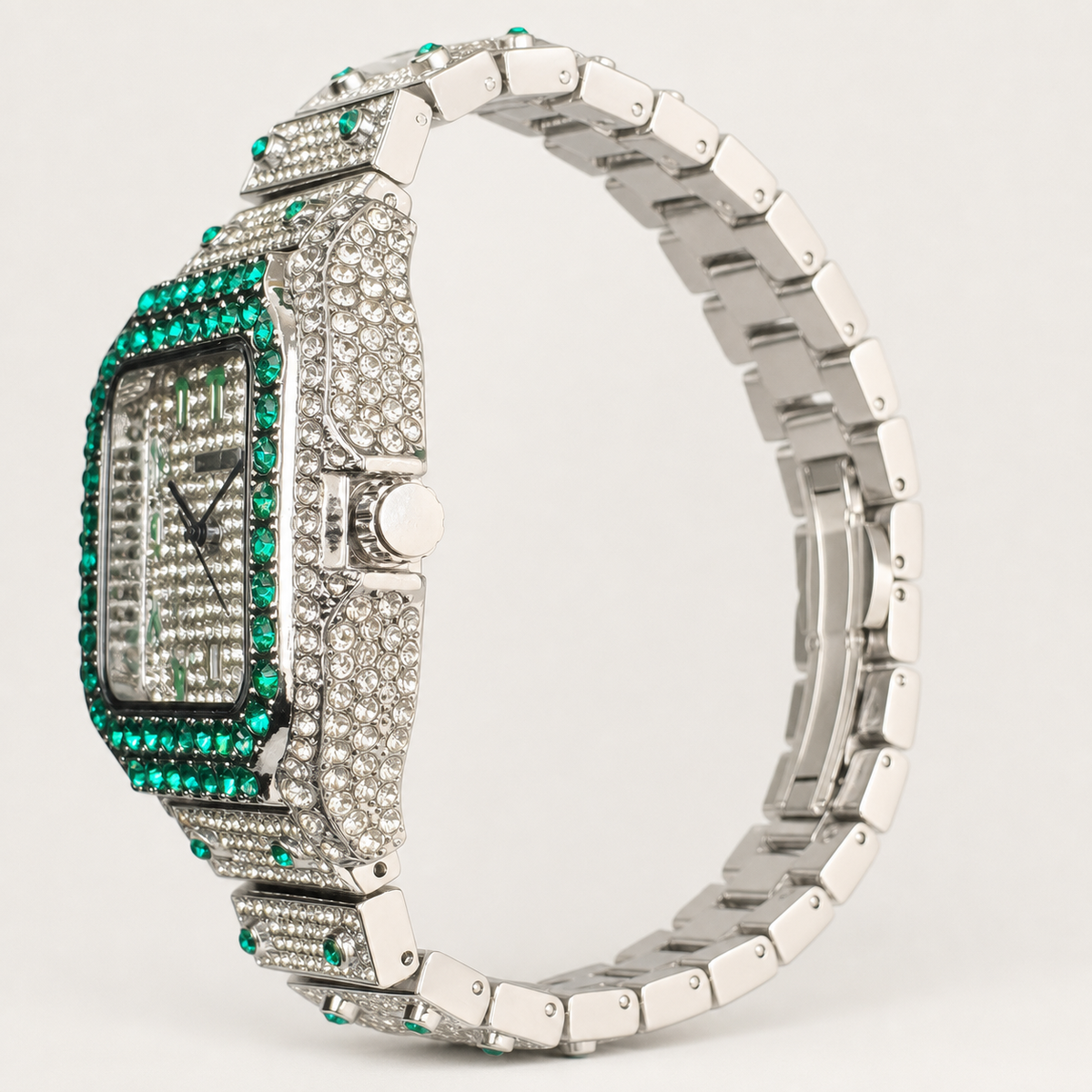 Side view of a silver-tone square watch with green border accents and segmented bracelet