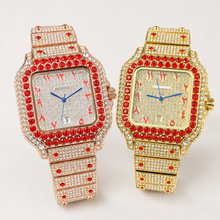 Rose-gold and gold-tone square watches with red border accents, displayed side by side