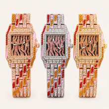 Rose-gold, silver and gold women’s square quartz watches with pink striped dials, arranged side by side