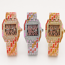 Front view of rose-gold, silver and gold square watches with pink striped dials and jeweled bracelets
