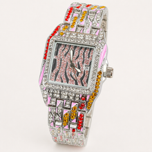Silver women’s square quartz watch with a pink striped dial and multicolour jewel-link bracelet, angled view