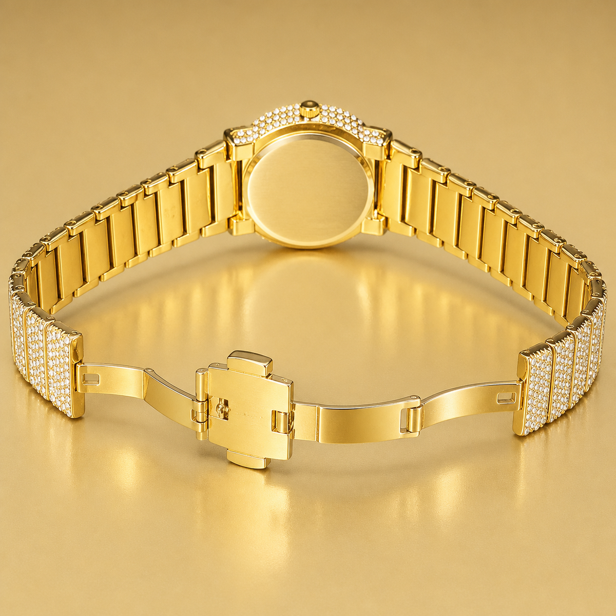 Gold-tone crystal-set watch with open deployant clasp and plain rear caseback