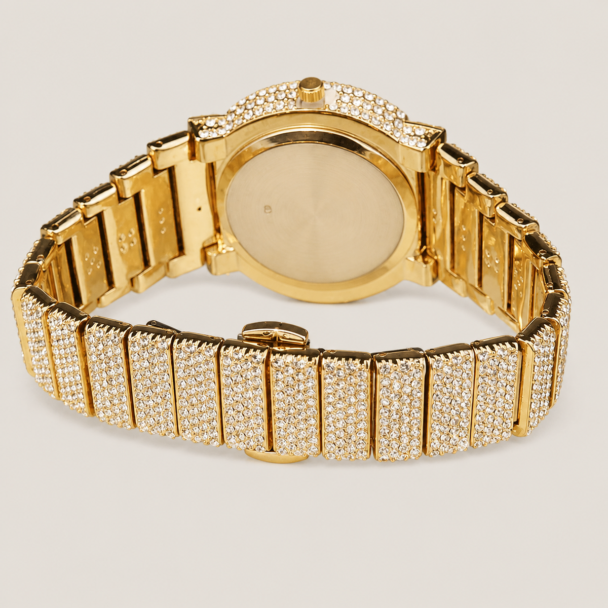 Gold-tone crystal-set watch with open bracelet clasp and rear caseback detail