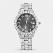 Silver-tone watch with light black Roman-numeral dial and crystal-set bracelet, front view