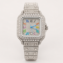 Silver-tone tonneau watch with multicolour Roman-numeral dial, three-quarter view