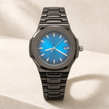 Montre à boîtier coussin gunmetal, cadran turquoise et bracelet sombre