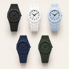 Five integrated-bracelet watches with Arabic-Indic numeral dials in black, white, blue, light blue and dark green
