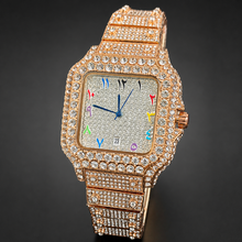 Rose-gold-tone crystal-set square watch with multicolour numeral markers, angled front view